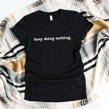 Load image into Gallery viewer, Busy Doing Nothing Tee Black with White Print
